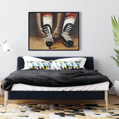 Toile encadrée « Joueur de hockey attachant ses patins » | Décoration d'intérieur sportive