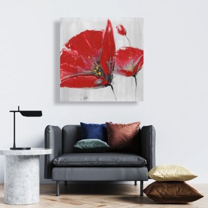 Three red flowers on gray background