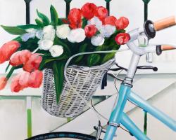 Bicycle with tulips flowers in basket