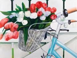 Bicycle with tulips flowers in basket