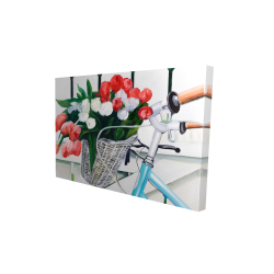 Bicycle with tulips flowers in basket