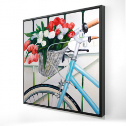 Bicycle with tulips flowers in basket