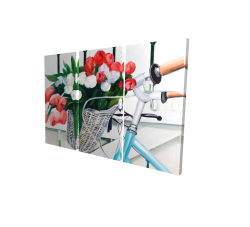 Bicycle with tulips flowers in basket